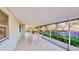 Relaxing screened patio with plenty of seating and view of landscaped backyard at 403 Tranquille Oaks Dr, Ocoee, FL 34761