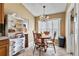 Dining area with chandelier, wood table, and built-in shelving unit at 4925 Cedarstone Ln, Orlando, FL 32822