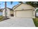 Lovely home with a two-car garage and well-maintained landscaping at 4925 Cedarstone Ln, Orlando, FL 32822