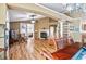 Inviting living room with fireplace, dining area, and open floor plan at 4925 Cedarstone Ln, Orlando, FL 32822