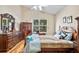 Main bedroom with plenty of dresser storage and wooden furniture at 4925 Cedarstone Ln, Orlando, FL 32822