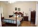 Comfortable main bedroom with wood floors and soft lighting at 4925 Cedarstone Ln, Orlando, FL 32822