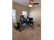 Home office with desk, elliptical, and window at 528 Cadiz Loop, Davenport, FL 33837