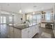 Spacious kitchen island with granite countertops, ample cabinetry, and an open layout that flows into the living area at 1379 Kiawah St, Celebration, FL 34747