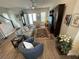 Comfortable living room with wood floors, neutral walls, stylish furniture, and a staircase to the side at 1379 Kiawah St, Celebration, FL 34747
