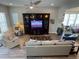 Bright living room with wood floors, ceiling fan, large built-in entertainment center and lots of natural light at 1379 Kiawah St, Celebration, FL 34747