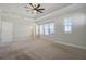 Bright and airy main bedroom with tray ceiling, large windows and neutral carpet at 1379 Kiawah St, Celebration, FL 34747
