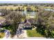 Aerial shot of a beautiful home with a tranquil lake view and private dock at 1845 Farrington Dr, Lakeland, FL 33809