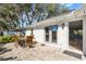 Back patio with brick floor and outdoor dining furniture at 1845 Farrington Dr, Lakeland, FL 33809
