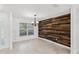 Dining area with stylish wood wall paneling and a modern light fixture at 1845 Farrington Dr, Lakeland, FL 33809