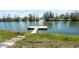 A private wooden dock extends into the serene lake, perfect for fishing and relaxing by the water at 1845 Farrington Dr, Lakeland, FL 33809