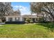 Inviting single-story home with neatly trimmed hedges and a green lawn at 1845 Farrington Dr, Lakeland, FL 33809