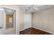 A neutrally painted bedroom with tile hallway and a closet for storage at 2441 Derby Dr, Deltona, FL 32738