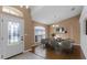Inviting dining room with modern chandelier and hardwood flooring, perfect for entertaining at 2441 Derby Dr, Deltona, FL 32738