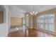 Open-concept home featuring hardwood flooring and views of the front door with decorative glass at 2441 Derby Dr, Deltona, FL 32738