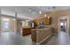 Well-lit kitchen with granite countertops, ample cabinet space, and an open layout perfect for cooking at 2441 Derby Dr, Deltona, FL 32738
