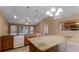 Large kitchen featuring a center island, granite countertops, and plenty of storage space, great for entertaining at 2441 Derby Dr, Deltona, FL 32738