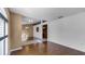 Open floor plan showing hardwood floors and a view into another room with a modern chandelier at 2441 Derby Dr, Deltona, FL 32738