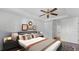 The staged main bedroom is filled with light and has modern decor and neutral accents at 2441 Derby Dr, Deltona, FL 32738