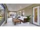 A spacious covered patio offers an outdoor seating area with views of the backyard at 2441 Derby Dr, Deltona, FL 32738