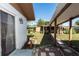 Landscaped backyard with a covered patio, providing a relaxing outdoor space for enjoying the nature at 2913 Joyann St, Orlando, FL 32810
