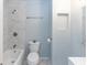 Clean bathroom featuring modern fixtures, including a shower-tub combo and a toilet with vanity sink at 2913 Joyann St, Orlando, FL 32810