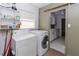 Efficient laundry room featuring modern appliances, ample counter space, with easy access to the kitchen at 2913 Joyann St, Orlando, FL 32810