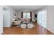 Bright living room featuring stylish decor, wood flooring, and ample natural light, perfect for relaxation and entertainment at 2913 Joyann St, Orlando, FL 32810