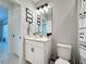 Stylish bathroom with modern vanity, quartz countertop, and black hardware at 678 Fiddlesticks Dr, Davenport, FL 33837