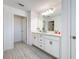 Stylish bathroom showcasing dual sinks, granite counters, and modern fixtures at 678 Fiddlesticks Dr, Davenport, FL 33837