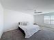 Bright bedroom with a comfortable bed, window view, and soft, neutral decor at 678 Fiddlesticks Dr, Davenport, FL 33837
