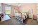 Stylishly decorated pink bedroom with ceiling fan and a window offering natural light at 678 Fiddlesticks Dr, Davenport, FL 33837