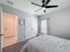 Cozy bedroom features a ceiling fan, double closet, and a neutral color scheme at 678 Fiddlesticks Dr, Davenport, FL 33837