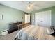 Inviting bedroom with carpet flooring, ceiling fan, closet and dresser for plenty of storage at 678 Fiddlesticks Dr, Davenport, FL 33837