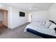 Comfortable bedroom featuring a queen size bed and wall-mounted television at 678 Fiddlesticks Dr, Davenport, FL 33837
