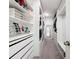 Spacious walk-in closet featuring custom organizers, shelving, and drawers for efficient storage at 678 Fiddlesticks Dr, Davenport, FL 33837