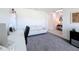 Bright home office space with a modern desk setup and a comfortable white sofa at 678 Fiddlesticks Dr, Davenport, FL 33837