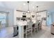 A beautifully designed kitchen with a large island and ample seating, perfect for entertaining at 678 Fiddlesticks Dr, Davenport, FL 33837