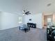 Spacious living room with a modern ceiling fan and a neutral color palette at 678 Fiddlesticks Dr, Davenport, FL 33837