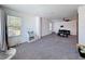 Spacious living room with reading nook and a contemporary entertainment area at 678 Fiddlesticks Dr, Davenport, FL 33837