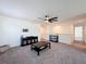 Bright living room featuring neutral colors, a ceiling fan, and stylish furnishings at 678 Fiddlesticks Dr, Davenport, FL 33837