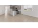 Open concept kitchen with an island, stainless steel appliances, and tile flooring at 9097 Wildlight Trl, Wildwood, FL 34785