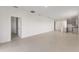 Spacious open-concept living area with neutral paint and tile flooring throughout at 9097 Wildlight Trl, Wildwood, FL 34785