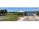 Waterfront property with a boat ramp, dock, and lush green landscaping by the water at 121 S Cory Dr, Edgewater, FL 32141