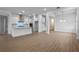 Spacious dining area with wood-look flooring and modern light fixture at 15086 Summer Harvest St, Winter Garden, FL 34787