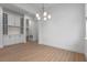 Bright dining area with wood-look flooring and elegant chandelier at 15086 Summer Harvest St, Winter Garden, FL 34787