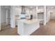 Bright kitchen featuring an island, stainless steel appliances, and white cabinets at 15086 Summer Harvest St, Winter Garden, FL 34787