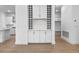 Modern wet bar with wine storage and white cabinetry at 15086 Summer Harvest St, Winter Garden, FL 34787