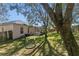 Large backyard with a playset and mature trees at 3954 Old Dunn Rd, Apopka, FL 32712