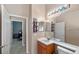 Bathroom with a sink, toilet, and access to another bedroom at 3954 Old Dunn Rd, Apopka, FL 32712